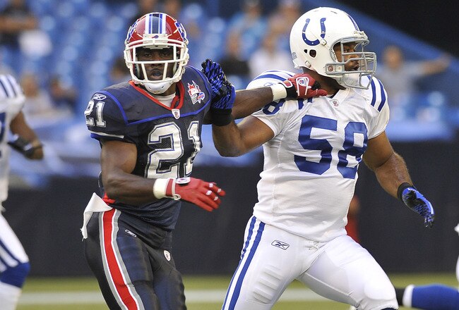 TORONTO, CANADA - AUGUST 19: C.J. Spiller #21 of the Buffalo Bills runs with Gary Brackett #58 of the Indianapolis Colts during game action August 19, 2010 at the Rogers Centre in Toronto, Ontario, Canada. (Photo by Brad White/Getty Images)