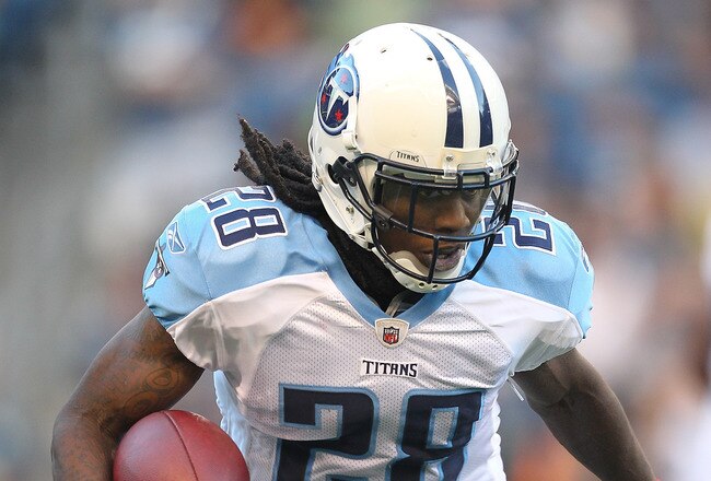 SEATTLE - AUGUST 14: Running back Chris Johnson #28 of the Tennessee Titans rushes against Aaron Curry #59 during the preseason game against the Seattle Seahawks at Qwest Field on August 14, 2010 in Seattle, Washington. (Photo by Otto Greule Jr/Getty Images)