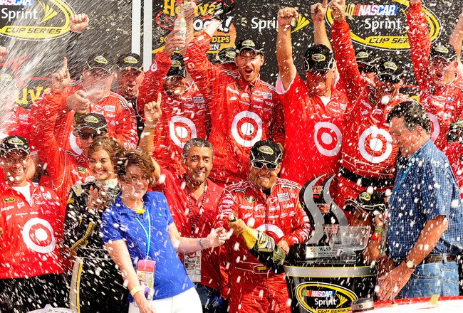 WATKINS GLEN, NY - AUGUST 08:  Juan Pablo Montoya (L), driver of the #42 Target Chevrolet, celebrates with his team after winning the NASCAR Sprint Cup Series Heluva Good! Sour Cream Dips at Watkins Glen International on August 8, 2010 in Watkins Glen, New York.  (Photo by Rusty Jarrett/Getty Images for NASCAR)