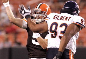 CLEVELAND - SEPTEMBER 2:  Brett Ratliff #5 of the Cleveland Browns passes through pressure from Jarron Gilbert #93 of the Chicago Bears during the preseason game on September 2, 2010 at Cleveland Browns Stadium in Cleveland, Ohio. The Browns defeated the Bears 13-10.  (Photo by Justin K. Aller/Getty Images)