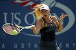 NEW YORK - SEPTEMBER 02:  Caroline Wozniacki of Denmark returns a shot to Kai-Lung Chang of Chinese Taipei during the Women's singles on day four of the 2010 U.S. Open at the USTA Billie Jean King National Tennis Center on September 2, 2010 in the Flushing neighborhood of the Queens borough of New York City.  (Photo by Al Bello/Getty Images)