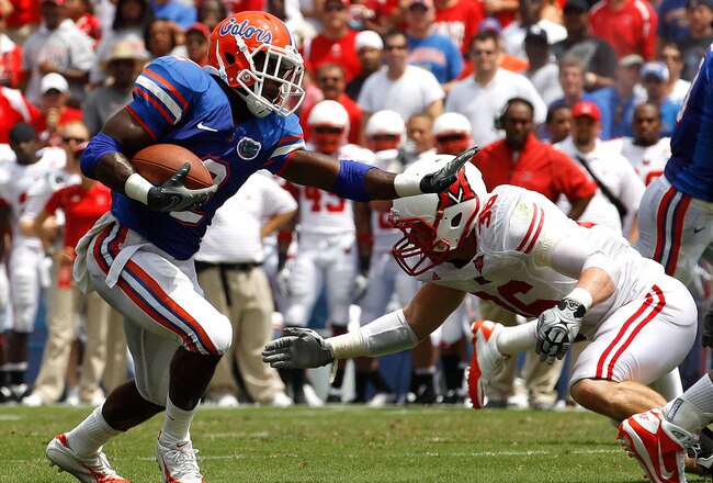 GAINESVILLE, FL - SEPTEMBER 04:  Jeffery Demps #2 of the Florida Gators attempts to run past Luke Kelly #36 of the Miami University RedHawks at Ben Hill Griffin Stadium on September 4, 2010 in Gainesville, Florida.  (Photo by Sam Greenwood/Getty Images)