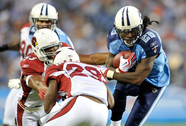 NASHVILLE, TN - AUGUST 23:  Chris Johnson #28 of the Tennessee Titans avoids defenders Clark Haggans #53 and Dominique Rogers-Cromartie #29 of te Arizona Cardinals during the first half of a preseason game at LP Field on August 23, 2010 in Nashville, Tennessee.  (Photo by Grant Halverson/Getty Images)