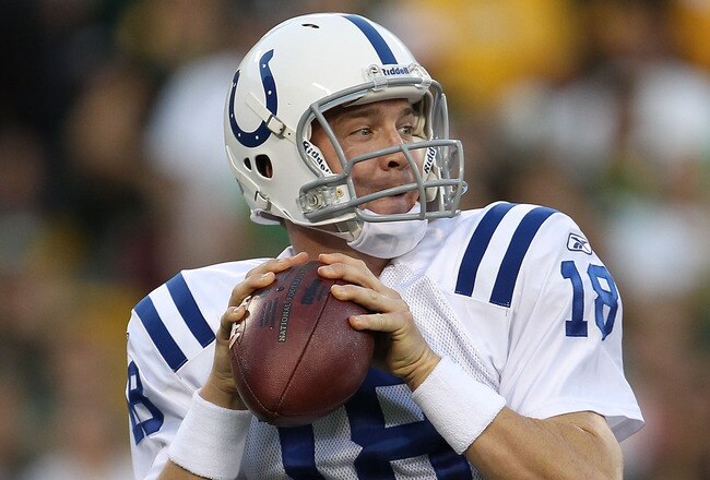 GREEN BAY, WI - AUGUST 26: Peyton Manning #18 of the Indianapolis Colts looks for a receiver against the Green Bay Packers during a preseason game at Lambeau Field on August 26, 2010 in Green Bay, Wisconsin.  The Packers defeated the Colts 59-24. (Photo by Jonathan Daniel/Getty Images)