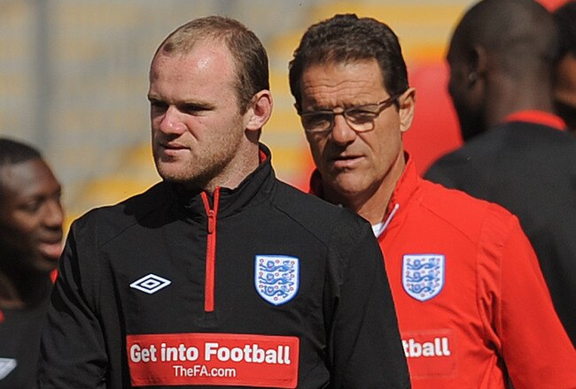 LONDON, ENGLAND - SEPTEMBER 02:  Wayne Rooney looks on with England manager Fabio Capello during the England training session at Wembley Stadium on September 2, 2010 in London, England.  (Photo by Michael Regan/Getty Images)