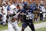 HOUSTON - SEPTEMBER 04:  Wide receiver Marquise Goodwin #84 of the Texas Longhorns can't reach the pass as he is defended by cornerback Chris Jammer #38 at Reliant Stadium on September 4, 2010 in Houston, Texas. Texas beat Rice 34-17. (Photo by Bob Levey/Getty Images)
