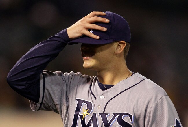 OAKLAND, CA - AUGUST 20:  Jeremy Hellickson #58 of the Tampa Bay Rays walks off the field after the sixth inning in which he gave up a home run to tie their game against the Oakland Athletics at the Oakland-Alameda County Coliseum  on August 20, 2010 in Oakland, California.  (Photo by Ezra Shaw/Getty Images)