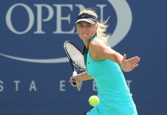 NEW YORK - SEPTEMBER 04: Maria Sharapova of Russia returns a shot against Beatrice Capra of the United States during the women's singles match on day six of the 2010 U.S. Open at the USTA Billie Jean King National Tennis Center on September 4, 2010 in the Flushing neighborhood of the Queens borough of New York City. Sharapova defeated Capra 6-0, 6-0. (Photo by Jim McIsaac/Getty Images)