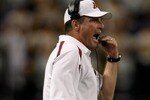 MINNEAPOLIS, MN - SEPTEMBER 08:  Head coach Tim Brewster leads the Minnesota Golden against the Miami of Ohio Redhawks as Minnesota defeated Miami of Ohio 41-35 in triple overtime at the Metrodome on September 8, 2007 in Minneapolis, Minnesota.  (Photo by Doug Pensinger/Getty Images)