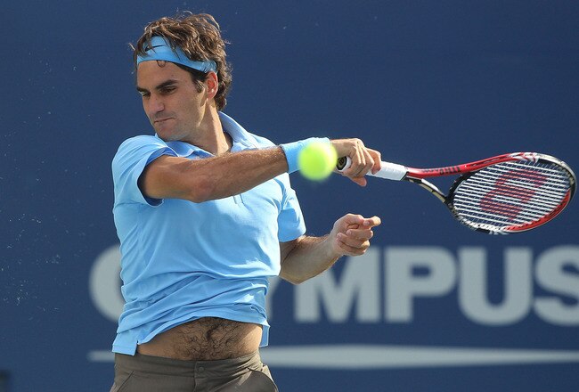 NEW YORK - SEPTEMBER 04:  Roger Federer of Switzerland returns a shot against Paul-Henri Mathieu of France during the men's singles match on day six of the 2010 U.S. Open at the USTA Billie Jean King National Tennis Center on September 4, 2010 in the Flushing neighborhood of the Queens borough of New York City.  (Photo by Jim McIsaac/Getty Images)