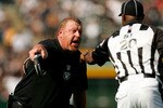OAKLAND, CA - SEPTEMBER 27:  Oakland Raiders head coach Tom Cable argues with side judge Barry Anderson during their game against the Denver Broncos at the Oakland-Alameda County Coliseum on September 27, 2009 in Oakland, California.  (Photo by Ezra Shaw/Getty Images)