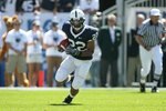 STATE COLLEGE, PA - SEPTEMBER 19: Running back Evan Royster #22 of the Penn State Nittany Lions carries the ball during a game against the Temple Owls on September 19, 2009 at Beaver Stadium in State College, Pennsylvania. (Photo by Hunter Martin/Getty Images)