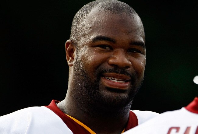 ASHBURN, VA - JULY 30:  Washington Redskins defensive tackle Albert Haynesworth (#92) talks with defensive end Andre Carter (#99) during opening day of training camp July 30, 2009 in Ashburn, Virginia.  (Photo by Win McNamee/Getty Images)