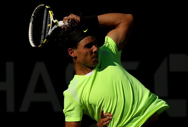 NEW YORK - SEPTEMBER 05:  Rafael Nadal of Spain returns a shot against Gilles Simon of France during the men's singles match on day seven of the 2010 U.S. Open at the USTA Billie Jean King National Tennis Center on September 5, 2010 in the Flushing neighborhood of the Queens borough of New York City.  Nadal defeated Simon 6-4, 6-4, 6-2.  (Photo by Nick Laham/Getty Images)