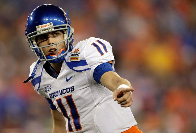 GLENDALE, AZ - JANUARY 04:  Quarterback Kellen Moore #11 of the Boise State Broncos points in the first half against the TCU Horned Frogs during the Tostitos Fiesta Bowl at the Universtity of Phoenix Stadium on January 4, 2010 in Glendale, Arizona.  (Photo by Jamie Squire/Getty Images)