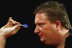 PURFLEET, UNITED KINGDOM - DECEMBER 22:  Colin Lloyd of Great Britain in action against Raymond Barneveld of the Netherlands during the Ladbrokes World Darts Championship at The Circus Tavern, on December 22, 2006 in Purfleet, England.  (Photo by Ian Walton/Getty Images)