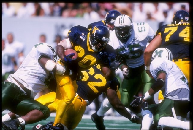 30 Aug 1997:  Amos Zereoue #20 of West Virginia carries the football during the Mountaineers 42-31 win over Marshall University at Mountaineer Field in Morgantown, West Virginia. Mandatory Credit: Rick Stewart  /Allsport