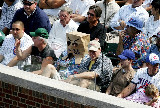 CHICAGO - AUGUST 31:  Chicago Cub fan Steve Strauss of Elmhurst, Illinois wears a bag over his head in the first row as the Cubs take on the Los Angeles Dodgers on August 31, 2005 at Wrigley Field in Chicago, Illinois. The Dodgers defeated the Cubs 7-0.  (Photo by Jonathan Daniel/Getty Images)