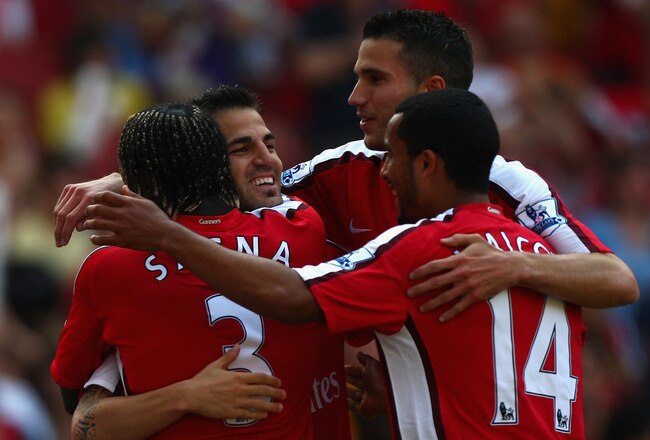 LONDON, ENGLAND - MAY 24:  Cesc Fabregas, Robin Van Persie and Theo Walcott of Arsenal celebrate after their first goal during the Barclays Premier League match between Arsenal and Stoke City at Emirates Stadium on May 24, 2009 in London, England.  (Photo by Ryan Pierse/Getty Images)