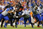 LANDOVER, MD - SEPTEMBER 06:  Quarterback #5 Tyrod Taylor of the Virginia Tech Hokies is tackled by defensive end #40 Tyrone Crawford, linebacker #33 Tommy Smith, and linebacker Aaron Tevis of the Boise State Broncos at FedExField on September 6, 2010 in Landover, Maryland.  (Photo by Geoff Burke/Getty Images)