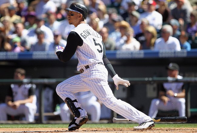 DENVER - SEPTEMBER 06:  Carlos Gonzalez #5 of the Colorado Rockies doubles in the first inning against the Cincinnati Reds at Coors Field on September 6, 2010 in Denver, Colorado. The Rockies defeated the Reds 10-5.  (Photo by Doug Pensinger/Getty Images)