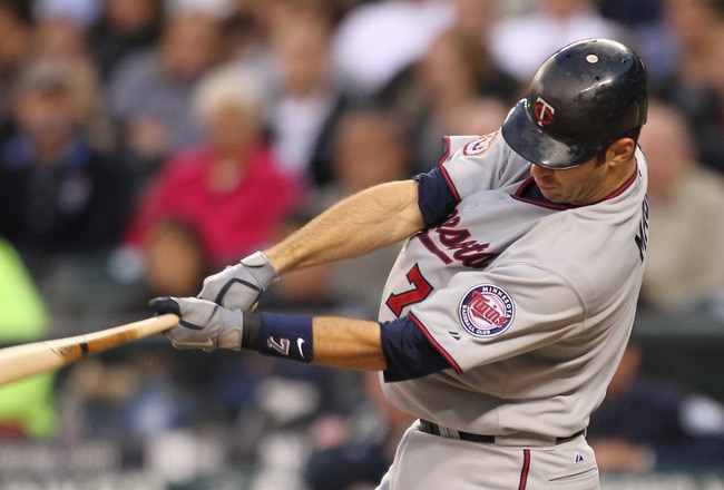 SEATTLE - AUGUST 27:  Joe Mauer #7 of the Minnesota Twins bats against the Seattle Mariners at Safeco Field on August 27, 2010 in Seattle, Washington. The Twins won 6-3. (Photo by Otto Greule Jr/Getty Images)