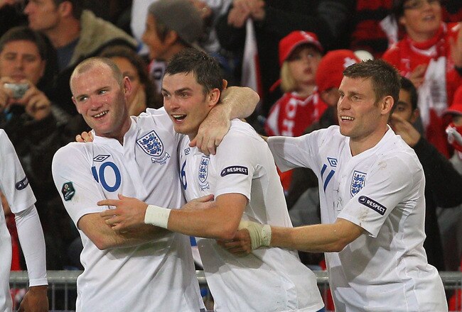 BASEL, SWITZERLAND - SEPTEMBER 07:  Adam Johnson of England celebrates his goal with Wayne Rooney during the UEFA EURO 2012 Group G Qualifier between Switzerland and England at St Jakob Park on September 7, 2010 in Basel, Switzerland.  (Photo by Clive Rose/Getty Images)