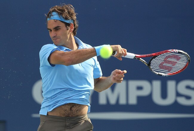 NEW YORK - SEPTEMBER 04:  Roger Federer of Switzerland returns a shot against Paul-Henri Mathieu of France during the men's singles match on day six of the 2010 U.S. Open at the USTA Billie Jean King National Tennis Center on September 4, 2010 in the Flushing neighborhood of the Queens borough of New York City.  (Photo by Jim McIsaac/Getty Images)