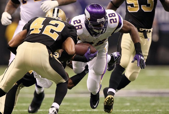 NEW ORLEANS - JANUARY 24:  Adrian Peterson #28 of the Minnesota Vikings runs the ball against the New Orleans Saints during the NFC Championship Game at the Louisiana Superdome on January 24, 2010 in New Orleans, Louisiana.  (Photo by Jed Jacobsohn/Getty Images)