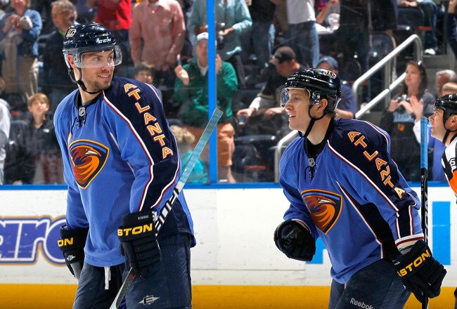 ATLANTA - APRIL 10:  Bryan Little #10 of the Atlanta Thrashers celebrates his goal against the Pittsburgh Penguins with Zach Bogosian #4 at Philips Arena on April 10, 2010 in Atlanta, Georgia.  (Photo by Kevin C. Cox/Getty Images)