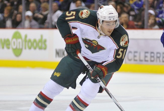 VANCOUVER, CANADA - APRIL 4:  James Sheppard #50 of the Minnesota Wild skates with the puck during the NHL game against the Vancouver Canucks on April 04, 2010 at General Motors Place in Vancouver, British Columbia, Canada.  (Photo by Rich Lam/Getty Images)