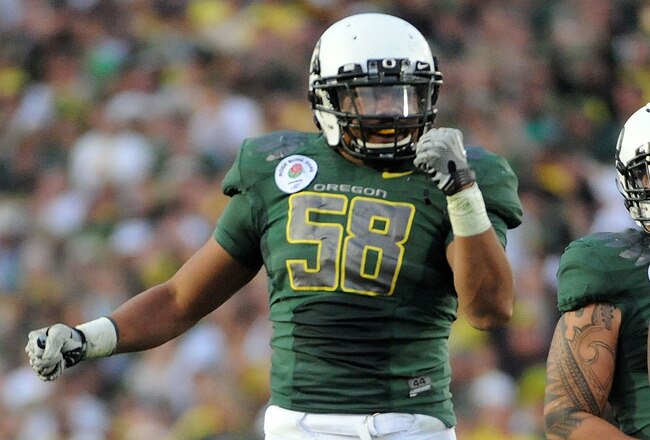 PASADENA, CA - JANUARY 01:  Linebacker Kenny Rowe #58 of the Oregon Ducks reacts after a play against the Ohio State Buckeyes at the 96th Rose Bowl game on January 1, 2010 in Pasadena, California.  (Photo by Harry How/Getty Images)