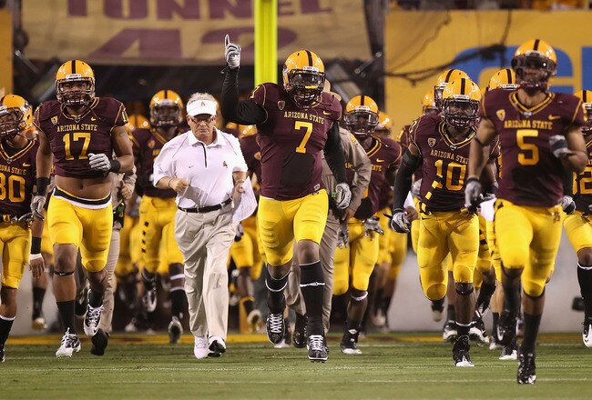TEMPE, AZ - SEPTEMBER 04:  (L-R) Gregory Smith #17, head coach Dennis Erickson, Vontaze Burfict #7 and Keelan Johnson #10 of the Arizona State Sun Devils lead teammates out onto the field prior the college football game against the Portland State Vikings at Sun Devil Stadium on September 4, 2010 in Tempe, Arizona. The Sun Devils defeated the Vikings 54-9. (Photo by Christian Petersen/Getty Images)