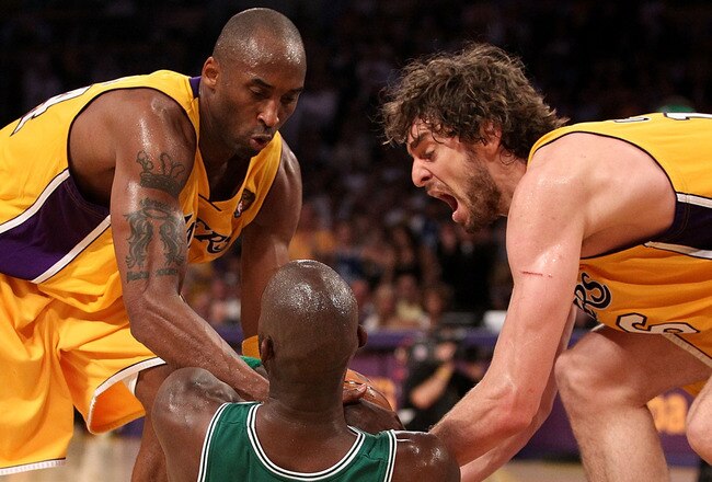 LOS ANGELES, CA - JUNE 15:  Kevin Garnett #5 of the Boston Celtics tries to hold on to the ball under pressure from Kobe Bryant #24, Derek Fisher #2 and Pau Gasol #16 of the Los Angeles Lakers in the first half of Game Six of the 2010 NBA Finals at Staples Center on June 15, 2010 in Los Angeles, California.  NOTE TO USER: User expressly acknowledges and agrees that, by downloading and/or using this Photograph, user is consenting to the terms and conditions of the Getty Images License Agreement.  (Photo by Christian Petersen/Getty Images)