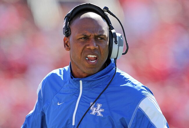 LOUISVILLE, KY - SEPTEMBER 04: Joker Phillips the Head Coach of the Kentucky Wildcats gives instructions to his team during the game against the Louisville Cardinals at Papa John's Cardinal Stadium on September 4, 2010 in Louisville, Kentucky.  (Photo by Andy Lyons/Getty Images)