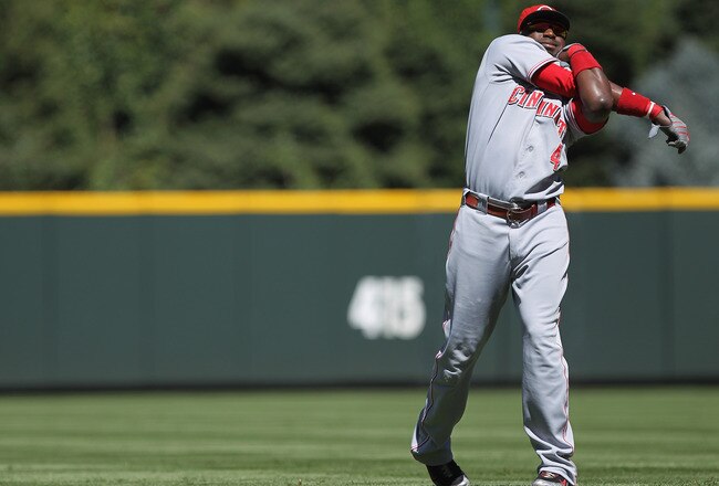 DENVER - SEPTEMBER 06:  Second baseman Brandon Phillips #4 of the Cincinnati Reds stretches prior to facing the Colorado Rockies at Coors Field on September 6, 2010 in Denver, Colorado. The Rockies defeated the Reds 10-5.  (Photo by Doug Pensinger/Getty Images)