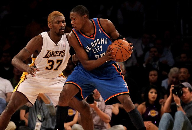 LOS ANGELES, CA - APRIL 18:  Kevin Durant #35 of the Oklahoma City Thunder controls the ball against Ron Artest #37 of the Los Angeles Lakers during Game One of the Western Conference Quarterfinals of the 2010 NBA Playoffs on April 18, 2010 at Staples Center in Los Angeles, California.  The Lakers won 87-79.  NOTE TO USER: User expressly acknowledges and agrees that, by downloading and/or using this Photograph, user is consenting to the terms and conditions of the Getty Images License Agreement.  (Photo by Stephen Dunn/Getty Images)