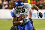 LANDOVER, MD - SEPTEMBER 06:  Running back #22 Doug Martin of the Boise State Broncos runs past linebacker #43 Jeron Gouveia-Winslow of the Virginia Tech Hokies at FedExField on September 6, 2010 in Landover, Maryland.  (Photo by Geoff Burke/Getty Images)