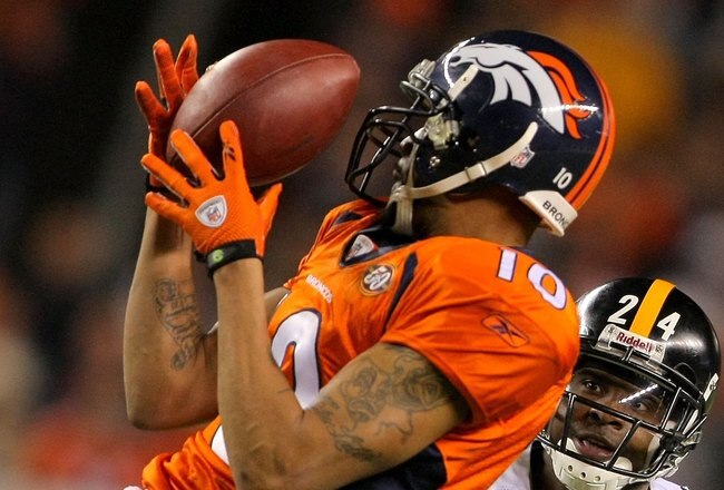 DENVER - NOVEMBER 09:  Cornerback Ike Taylor #24 of the Pittsburgh Steelers look to make the tackle as Jabar Gaffney #10 of the Denver Broncos makes a pass reception during NFL action at Invesco Field at Mile High on November 9, 2009 in Denver, Colorado. The Steelers defeated the Broncos 28-10.  (Photo by Doug Pensinger/Getty Images)