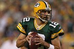 GREEN BAY, WI - AUGUST 26: Aaron Rodgers #12 of the Green Bay Packers looks for a receiver against the Indianapolis Colts during a preseason game at Lambeau Field on August 26, 2010 in Green Bay, Wisconsin. The Packers defeated the Colts 59-24.  (Photo by Jonathan Daniel/Getty Images)