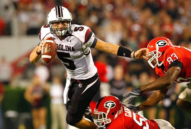ATHENS, GA - SEPTEMBER 12:  Darryl Gamble #50 and Cornelius Washington #83 of the Georgia Bulldogs sack quarterback Stephen Garcia #5 of the South Carolina Gamecocks at Sanford Stadium on September 12, 2009 in Athens, Georgia.  (Photo by Kevin C. Cox/Getty Images)