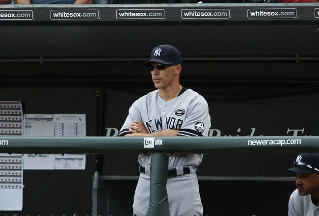 CHICAGO - AUGUST 29: Manager Joe Girardi #28 and bench coach Tony Pena # 56 of the New York Yankees watch their team take on the Chicago White Sox at U.S. Cellular Field on August 29, 2010 in Chicago, Illinois. The Yankees defeated the White Sox 2-1. (Photo by Jonathan Daniel/Getty Images)