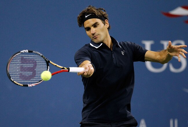 NEW YORK - SEPTEMBER 08:  Roger Federer of Switzerland returns a shot against Robin Soderling of Sweden during his men's singles quarterfinal match on day ten of the 2010 U.S. Open at the USTA Billie Jean King National Tennis Center on September 8, 2010 in the Flushing neighborhood of the Queens borough of New York City.  (Photo by Matthew Stockman/Getty Images)