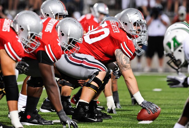COLUMBUS, OH - SEPTEMBER 2: Michael Brewster #50 of the Ohio State Buckeyes gets ready to snap the ball against the Marshall Thundering Herd at Ohio Stadium on September 2, 2010 in Columbus, Ohio. (Photo by Jamie Sabau/Getty Images)