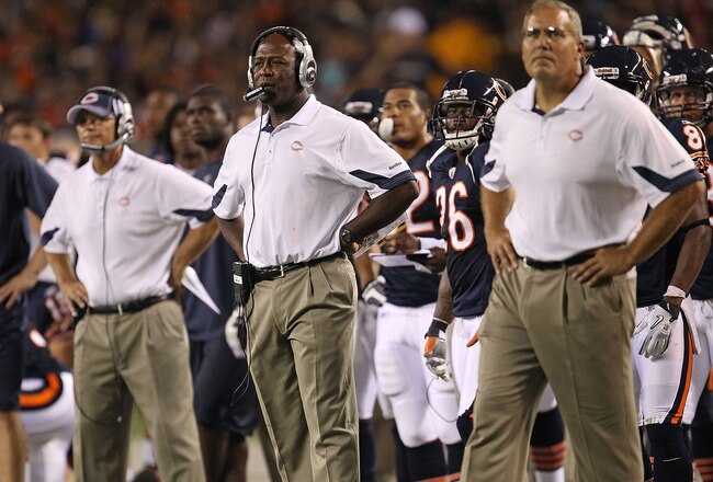 CHICAGO - AUGUST 28: Head coach Lovie Smith of the Chicago Bears (C) watches along with defensive coorindator Rod Marinelli (L) and special teams coordinator Dave Toub (R) as their team takes on the Arizona Cardinals during a preseason game at Soldier Field on August 28, 2010 in Chicago, Illinois. The Cardinals defeated the Bears 14-9. (Photo by Jonathan Daniel/Getty Images)