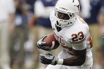 HOUSTON - SEPTEMBER 04:  Running back Tre' Newton #23 rushes in the first half against the Rice Owls at Reliant Stadium on September 4, 2010 in Houston, Texas.  (Photo by Bob Levey/Getty Images)
