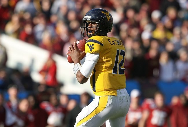 JACKSONVILLE, FL - JANUARY 01:  Quarterback Geno Smith #12 of the West Virginia Mountaineers drops back to pass against the Florida State Seminoles during the Konica Minolta Gator Bowl on January 1, 2010 at Jacksonville Municipal Stadium in Jacksonville, Florida. Florida State defeated West Virginia 33-21 in Bobby Bowden's last game as a head coach for the Seminoles.  (Photo by Doug Benc/Getty Images)