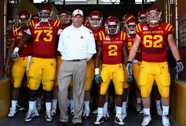 TEMPE, AZ - DECEMBER 31:  (L-R) Reggie Stephens #73, head coach Paul Rhoads, Sedrick Johnson #2 and Nate Frere #62 of the Iowa State Cyclones stand with teammates as they prepare to take the field before the Insight Bowl against the Minnesota Golden Gophers at Arizona Stadium on December 31, 2009 in Tempe, Arizona.  (Photo by Christian Petersen/Getty Images)