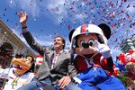 LAKE BUENA VISTA, FL - FEBRUARY 08:  In this handout photo provided by Disney, Super Bowl XLIV MVP Drew Brees joins Mickey Mouse in a celebratory parade in the Magic Kingdom on February 8, 2010 in Lake Buena Vista, Florida.  Brees, the quarterback of the New Orleans Saints, is the latest celebrity to star in the 'I'm Going to Disney World!' and 'I'm Going to Disneyland' commercials which aired only hours after last night's NFL championship game ended.  Brees led his team to a 31-17 victory over the AFC champion Indianapolis Colts in Super Bowl XLIV in Miami.  (Photo by David Roark/Disney via Getty Images)
