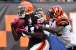 CLEVELAND - OCTOBER 04: Mohamed Massaquoi #11 of the Cleveland Browns makes a catch at the 1 yard line against Jonathan Joseph #22 of the Cincinnati Bengals during their game at Cleveland Browns Stadium on October 4, 2009 in Cleveland, Ohio.  (Photo by Jim McIsaac/Getty Images)